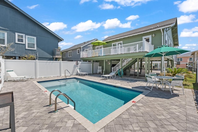 161 Easy St, Garden City Beach, SC 29576 - community pool with stairs, a wooden deck, and a patio area