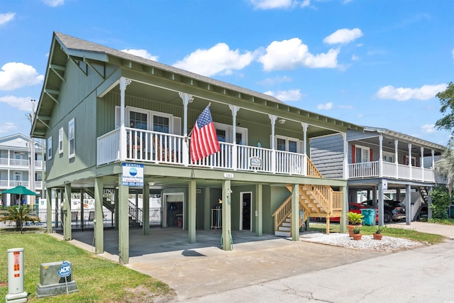 161 Easy St, Garden City Beach, SC 29576 - view of property featuring stairway, a carport, and concrete driveway