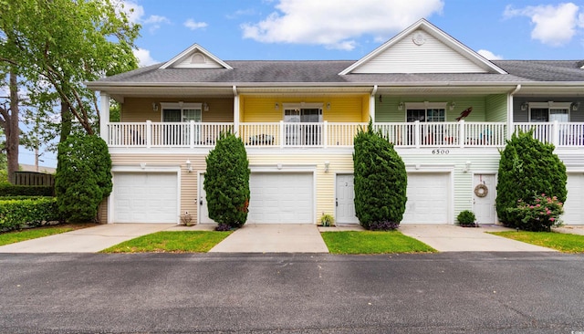 6500 Colonial Dr Unit 2, Myrtle Beach, SC 29572 - view of front of home featuring a garage, driveway, and roof with shingles