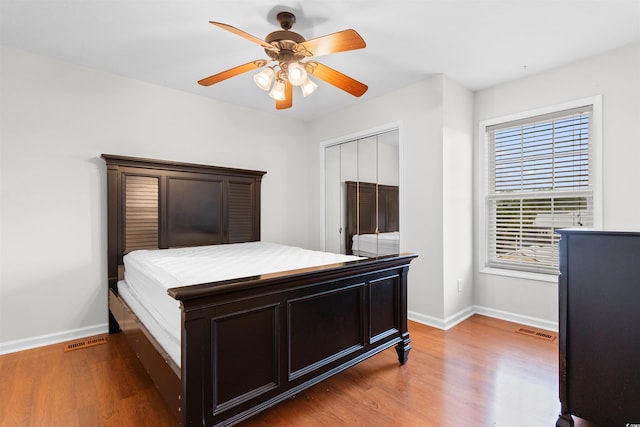 6500 Colonial Dr Unit 2, Myrtle Beach, SC 29572 - bedroom featuring wood finished floors, ceiling fan, and a closet