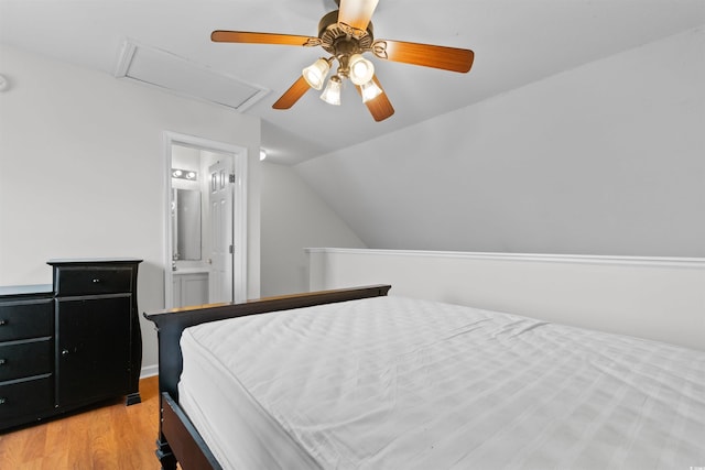 6500 Colonial Dr Unit 2, Myrtle Beach, SC 29572 - bedroom with light wood-style floors, lofted ceiling, attic access, connected bathroom, and a ceiling fan