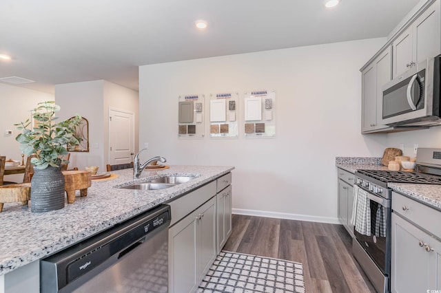 2889 Riverboat Way, Conway, SC 29526 - kitchen featuring appliances with stainless steel finishes, dark wood-type flooring, gray cabinets, light stone countertops, and recessed lighting