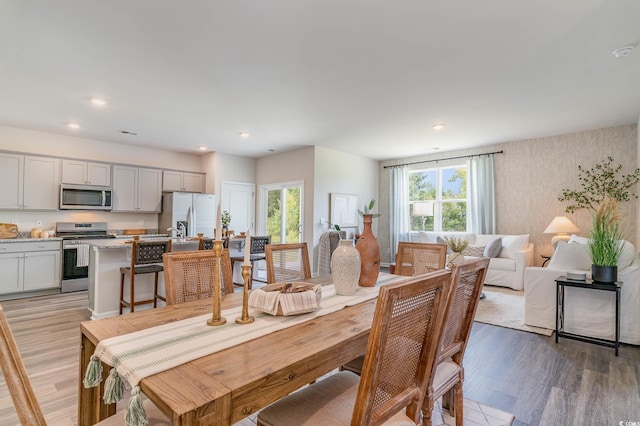2889 Riverboat Way, Conway, SC 29526 - dining space featuring light wood-type flooring, wallpapered walls, and recessed lighting