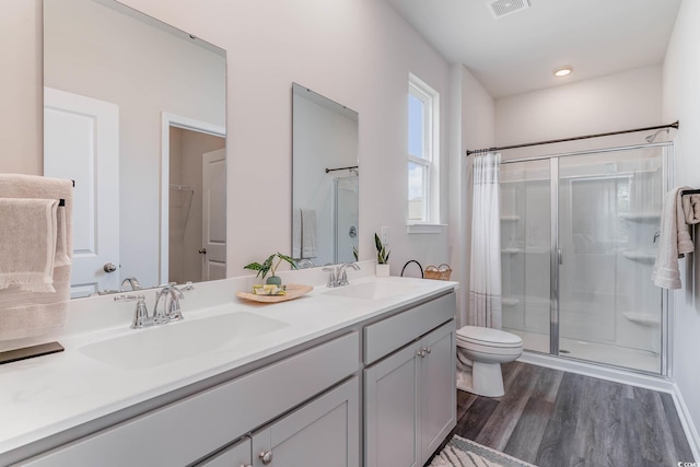 2889 Riverboat Way, Conway, SC 29526 - bathroom featuring a shower stall, wood finished floors, and double vanity