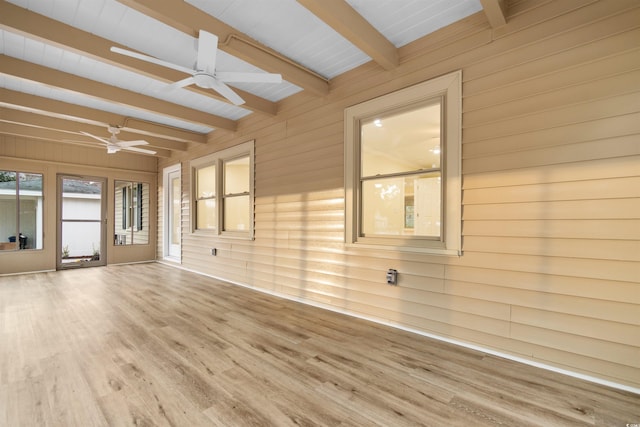 409 14th Ave S, North Myrtle Beach, SC 29582 - spare room featuring a ceiling fan, beamed ceiling, wood walls, and wood finished floors