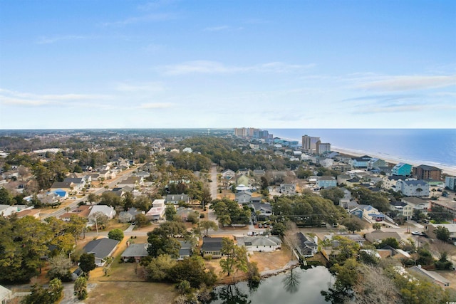 409 14th Ave S, North Myrtle Beach, SC 29582 - aerial overview of property's location featuring a large body of water, nearby suburban area, and nearby urban area