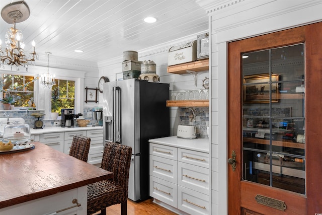 309 Sunset Trl, Myrtle Beach, SC 29577 - kitchen featuring stainless steel fridge with ice dispenser, a chandelier, open shelves, white cabinets, and decorative light fixtures