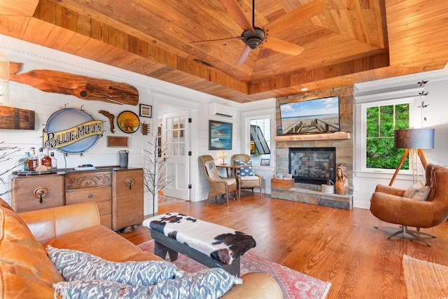 309 Sunset Trl, Myrtle Beach, SC 29577 - living area with wooden ceiling, wood finished floors, a raised ceiling, ceiling fan, and a fireplace