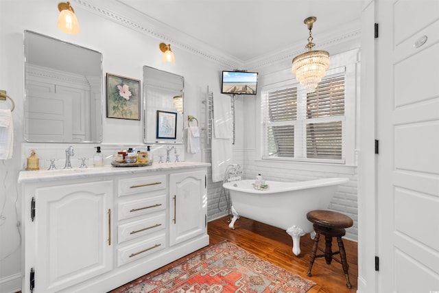 309 Sunset Trl, Myrtle Beach, SC 29577 - full bath with double vanity, a soaking tub, wood finished floors, crown molding, and a chandelier