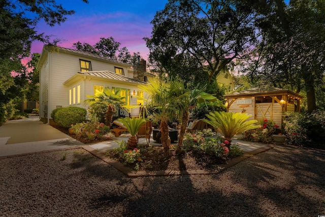 309 Sunset Trl, Myrtle Beach, SC 29577 - view of front of property featuring a standing seam roof, a chimney, and metal roof