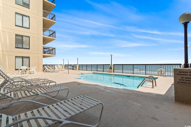 4000 N Ocean Blvd Unit 506, North Myrtle Beach, SC 29582 - community pool featuring a patio area