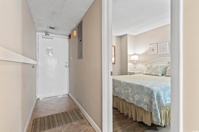 4000 N Ocean Blvd Unit 506, North Myrtle Beach, SC 29582 - hall with a textured ceiling, tile patterned flooring, baseboards, and electric panel