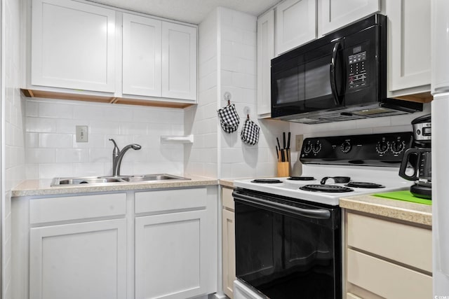 4000 N Ocean Blvd Unit 506, North Myrtle Beach, SC 29582 - kitchen featuring range with electric stovetop, black microwave, a sink, decorative backsplash, and white cabinetry