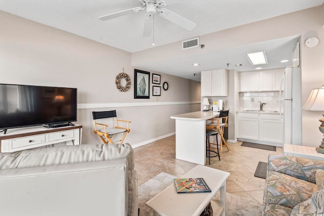 4000 N Ocean Blvd Unit 506, North Myrtle Beach, SC 29582 - living area with ceiling fan and baseboards