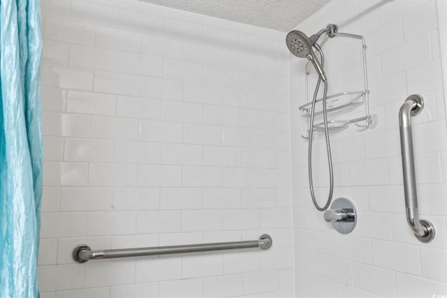 4000 N Ocean Blvd Unit 506, North Myrtle Beach, SC 29582 - bathroom with tiled shower and a textured ceiling