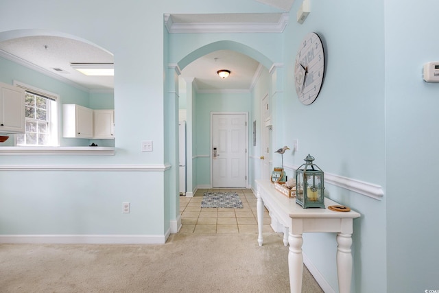 6015 Catalina Dr Unit 134, North Myrtle Beach, SC 29582 - corridor featuring crown molding, arched walkways, light carpet, and baseboards