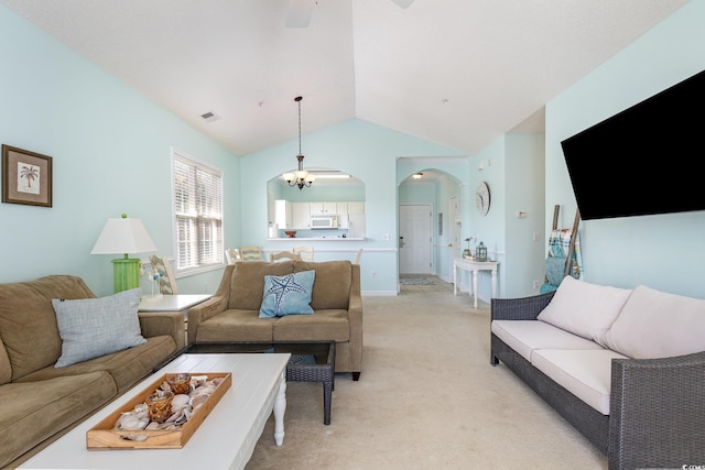 6015 Catalina Dr Unit 134, North Myrtle Beach, SC 29582 - living room featuring arched walkways, light colored carpet, lofted ceiling, a ceiling fan, and a chandelier