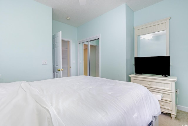 6015 Catalina Dr Unit 134, North Myrtle Beach, SC 29582 - bedroom with a closet, light colored carpet, a ceiling fan, and baseboards