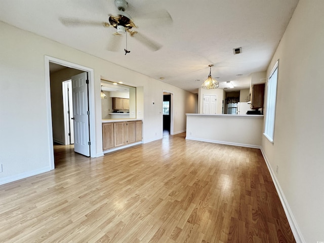 665 Tupelo Ln Unit 17-D, Longs, SC 29568 - unfurnished living room with a ceiling fan, light wood-style flooring, and baseboards