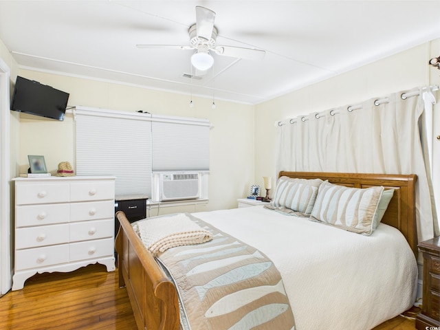 401 17th Ave S, North Myrtle Beach, SC 29582 - bedroom with cooling unit, dark wood-style flooring, and a ceiling fan