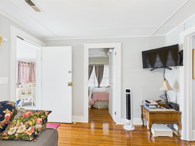 401 17th Ave S, North Myrtle Beach, SC 29582 - bedroom with wood finished floors, crown molding, and baseboards
