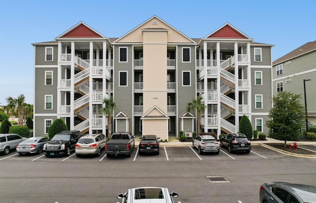 186 Ella Kinley Cir Unit 101, Myrtle Beach, SC 29588 - view of apartment building / complex featuring uncovered parking and stairs