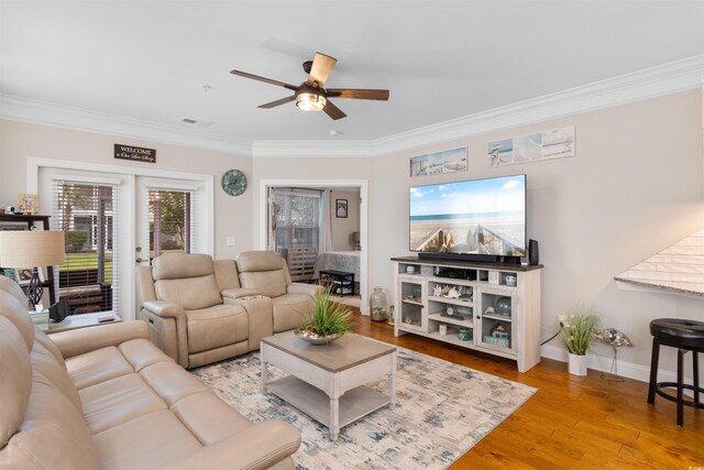 186 Ella Kinley Cir Unit 101, Myrtle Beach, SC 29588 - living area featuring crown molding, ceiling fan, wood finished floors, and baseboards