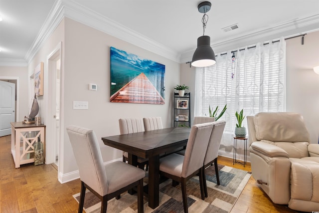 186 Ella Kinley Cir Unit 101, Myrtle Beach, SC 29588 - dining area featuring ornamental molding, light wood-type flooring, and baseboards