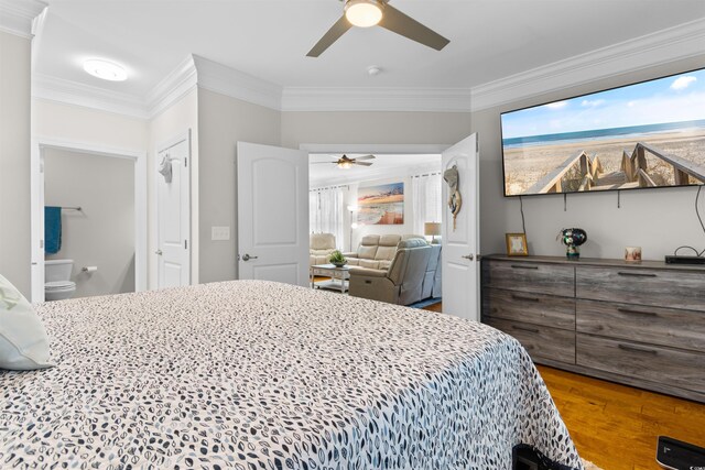 186 Ella Kinley Cir Unit 101, Myrtle Beach, SC 29588 - bedroom featuring crown molding, wood finished floors, ceiling fan, and ensuite bath