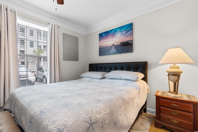 186 Ella Kinley Cir Unit 101, Myrtle Beach, SC 29588 - bedroom with crown molding, ceiling fan, and wood finished floors