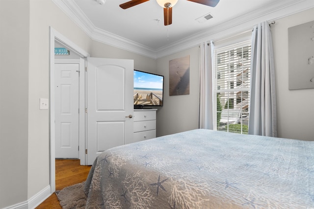 186 Ella Kinley Cir Unit 101, Myrtle Beach, SC 29588 - bedroom with wood finished floors, crown molding, and a ceiling fan