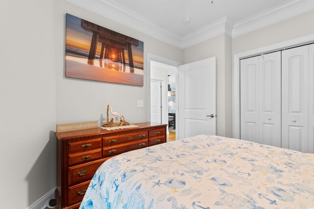 186 Ella Kinley Cir Unit 101, Myrtle Beach, SC 29588 - bedroom with a closet, crown molding, and baseboards