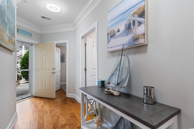 186 Ella Kinley Cir Unit 101, Myrtle Beach, SC 29588 - foyer featuring crown molding, light wood finished floors, and baseboards
