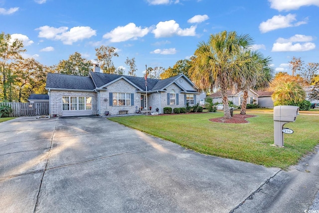 156 Hummingbird Ct, Myrtle Beach, SC 29579 - ranch-style house with concrete driveway, a chimney, and brick siding