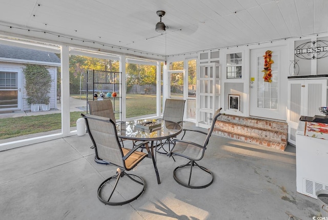 156 Hummingbird Ct, Myrtle Beach, SC 29579 - sunroom with entry steps, ceiling fan, and outdoor dining area