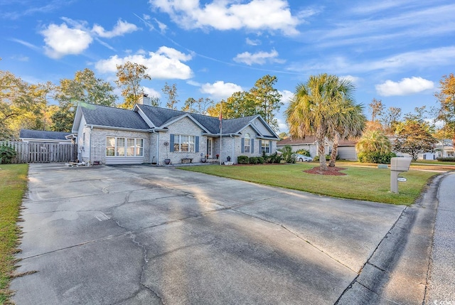 156 Hummingbird Ct, Myrtle Beach, SC 29579 - ranch-style house featuring driveway and a chimney