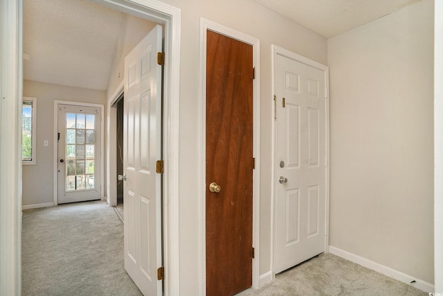 510 Fairwood Lakes Dr Unit 18N, Myrtle Beach, SC 29577 - corridor featuring light colored carpet, baseboards, and a textured ceiling