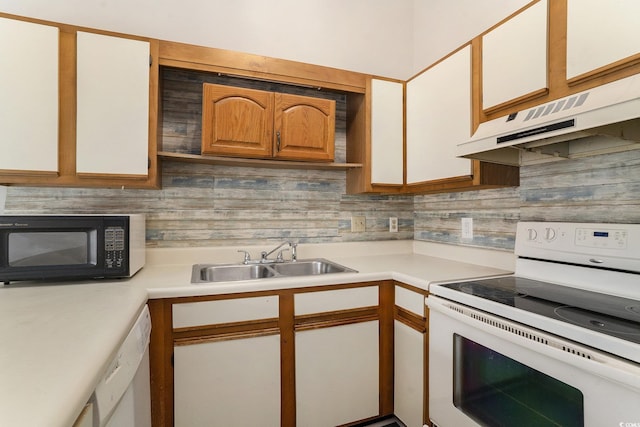 510 Fairwood Lakes Dr Unit 18N, Myrtle Beach, SC 29577 - kitchen featuring white appliances, a sink, under cabinet range hood, and light countertops