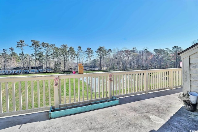 510 Fairwood Lakes Dr Unit 18N, Myrtle Beach, SC 29577 - view of patio featuring view of wooded area