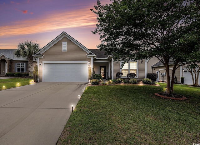 15 Saltwind Loop, Murrells Inlet, SC 29576 - view of front of house featuring an attached garage, concrete driveway, and a yard