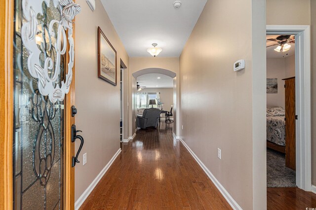 15 Saltwind Loop, Murrells Inlet, SC 29576 - hallway with arched walkways, hardwood / wood-style flooring, and baseboards