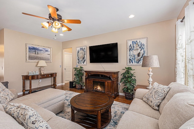 15 Saltwind Loop, Murrells Inlet, SC 29576 - living area with ceiling fan, baseboards, wood finished floors, recessed lighting, and a lit fireplace