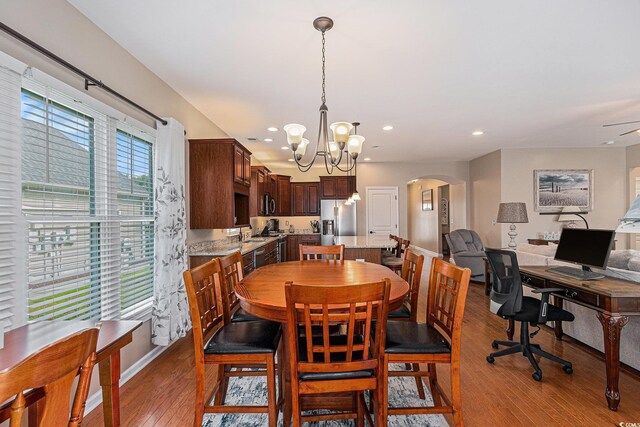15 Saltwind Loop, Murrells Inlet, SC 29576 - dining room with arched walkways, wood-type flooring, a chandelier, recessed lighting, and a desk