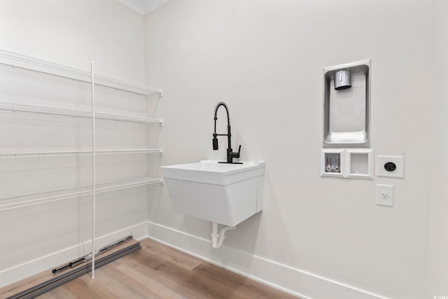 4617 Hedrick St, North Myrtle Beach, SC 29582 - laundry area featuring wood finished floors and electric dryer hookup