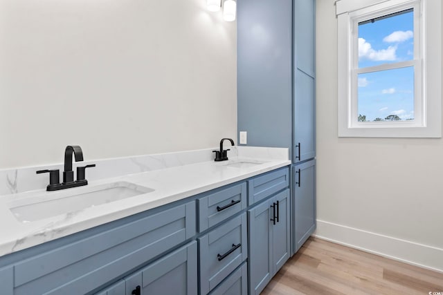 4617 Hedrick St, North Myrtle Beach, SC 29582 - bathroom featuring wood finished floors and double vanity