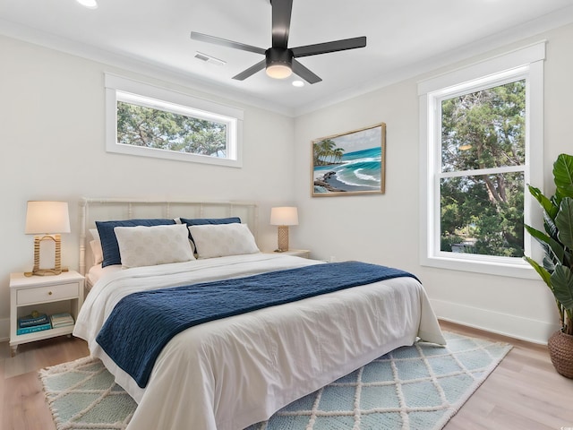 4617 Hedrick St, North Myrtle Beach, SC 29582 - bedroom featuring wood finished floors, crown molding, ceiling fan, and recessed lighting