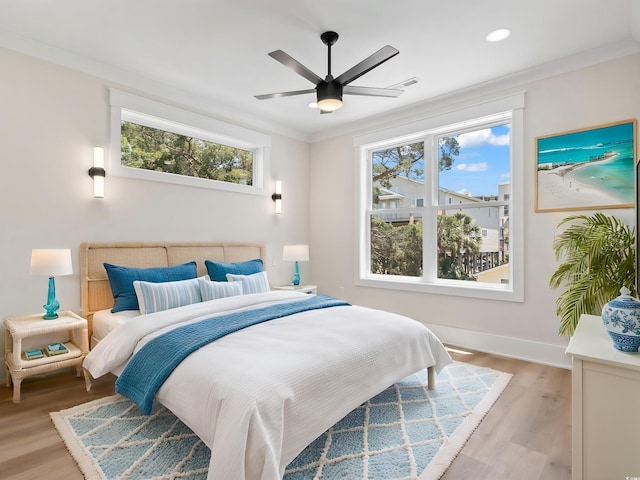 4617 Hedrick St, North Myrtle Beach, SC 29582 - bedroom with light wood finished floors, ornamental molding, ceiling fan, and recessed lighting