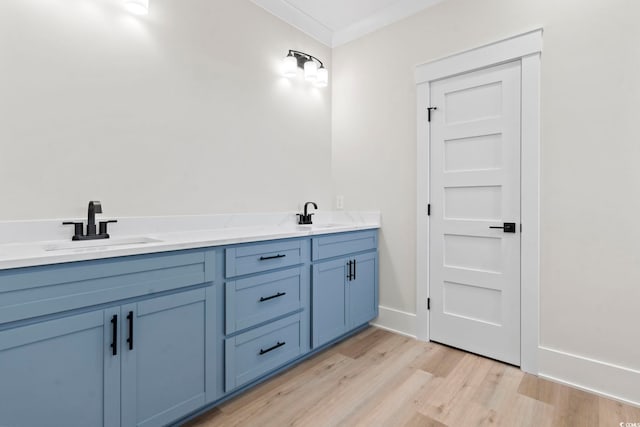 4617 Hedrick St, North Myrtle Beach, SC 29582 - bathroom with wood finished floors, double vanity, and ornamental molding