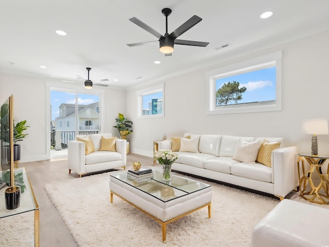 4617 Hedrick St, North Myrtle Beach, SC 29582 - living area featuring a ceiling fan, crown molding, light wood-style floors, and recessed lighting