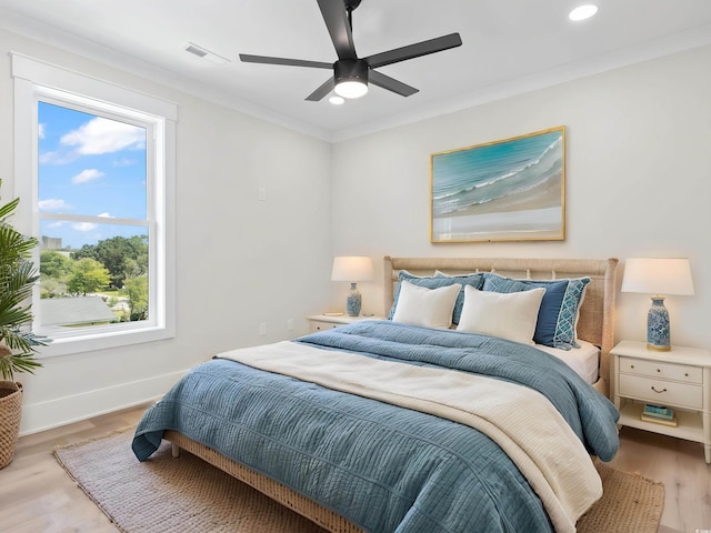 4617 Hedrick St, North Myrtle Beach, SC 29582 - bedroom featuring multiple windows, wood finished floors, recessed lighting, ornamental molding, and a ceiling fan